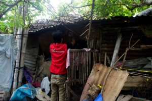 Enumerator posts a sticker as proof of assessment