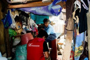 The enumerator conducts a household assessment in Lapu-Lapu City using android device