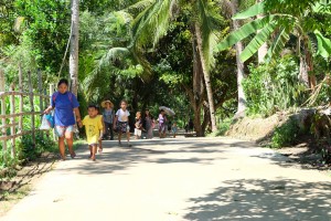 With this paved road in barangay Secante Bag-o, children and adults will no longer have muddy feet when traversing this road on rainy days. Eladio O. Portarcos, 63 years old, barangay captain of Secante-Bag-o.